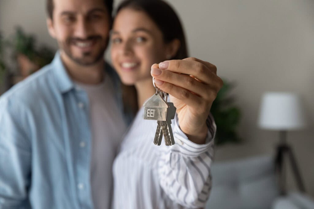 Phoenix Area Home Buyers Receiving Keys at Closing | Red Penny Realty First time buyer receiving keys to their new home
