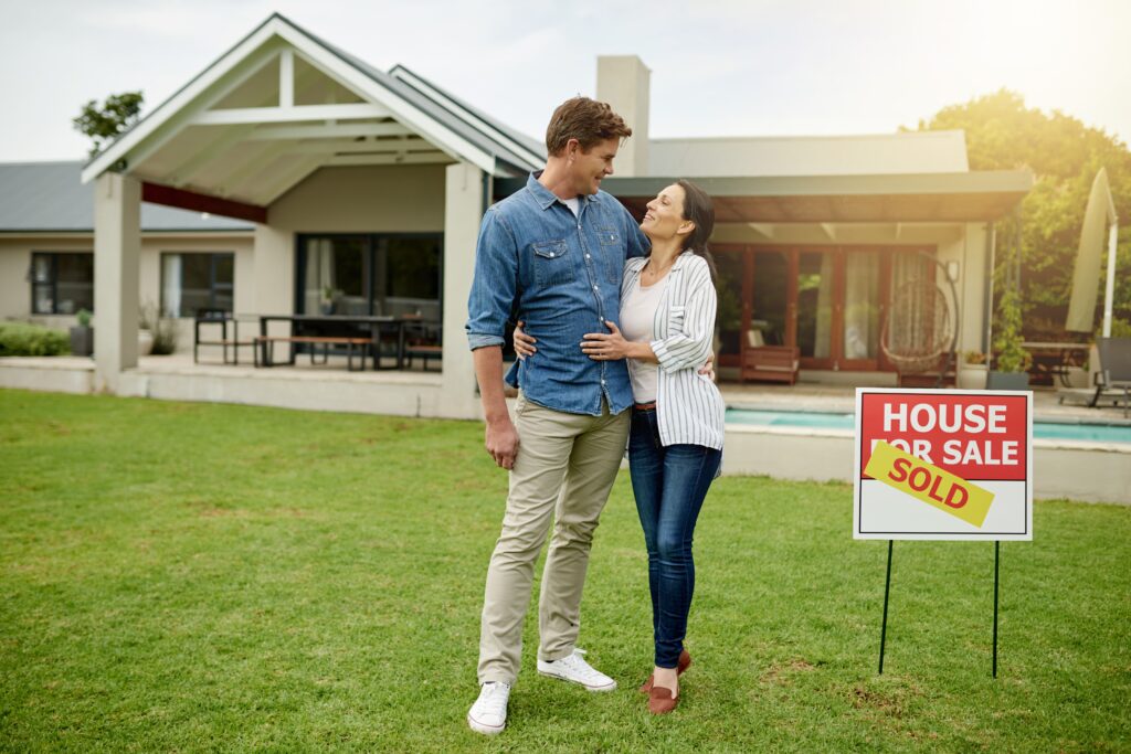 PurchaseRealEstateAndNewHomeForCoupleHugAnd | Red Penny Realty Mesa couple who are ready to sell their home
