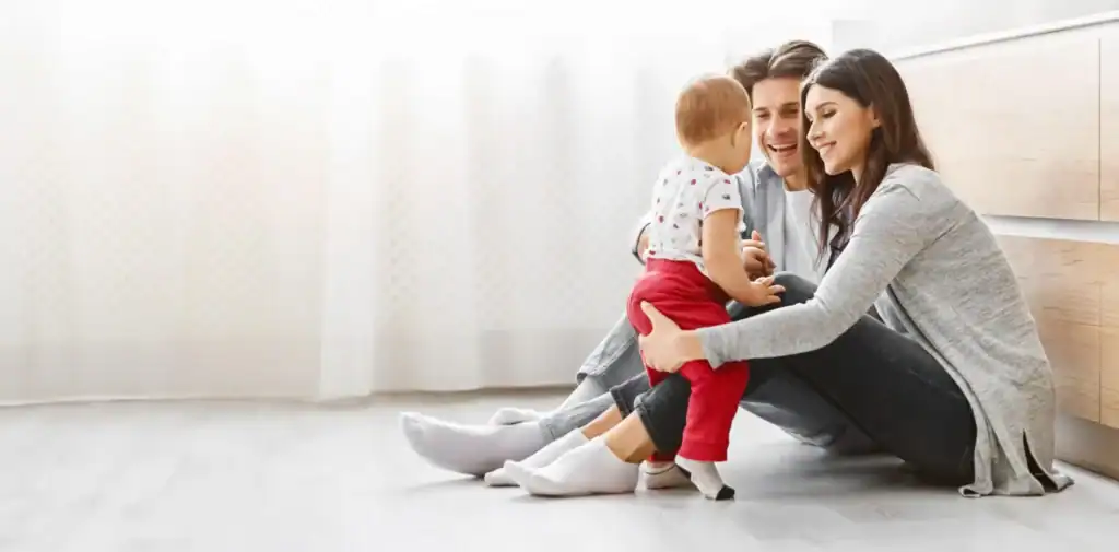 Red Penny Realty Photo 9 WebP | Red Penny Realty Mesa family enjoying their new home with their baby