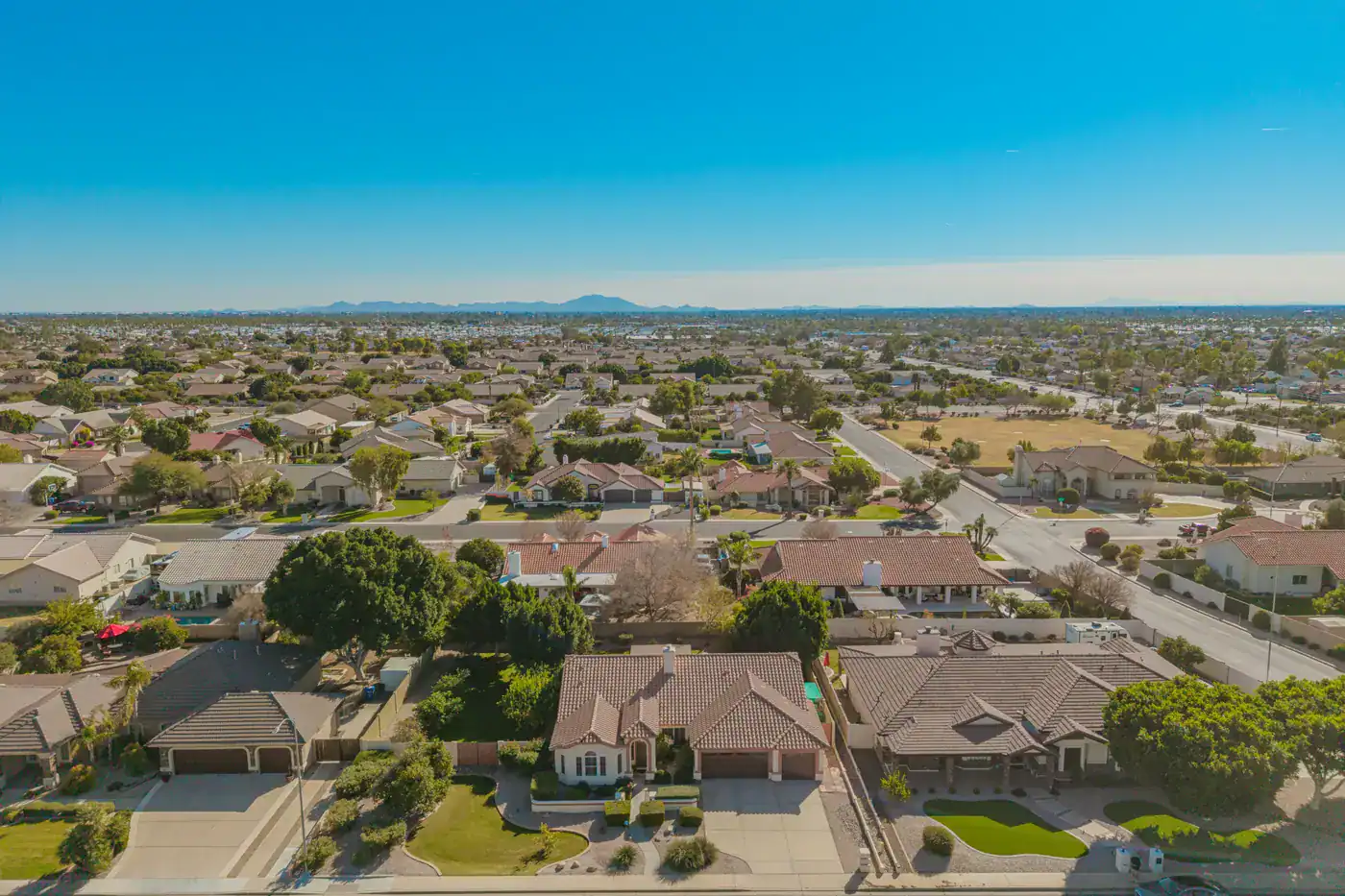 Mesa AZ Homes and Interest Rates | Red Penny Realty Residential street of homes in Mesa, Arizona